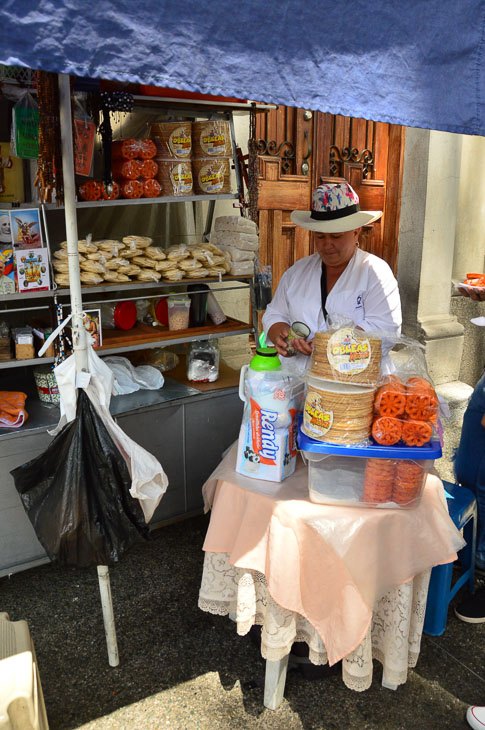 Perfect Colombia Itinerary 2 Weeks including the Rainbow River 3 woman with street stall in Bogota