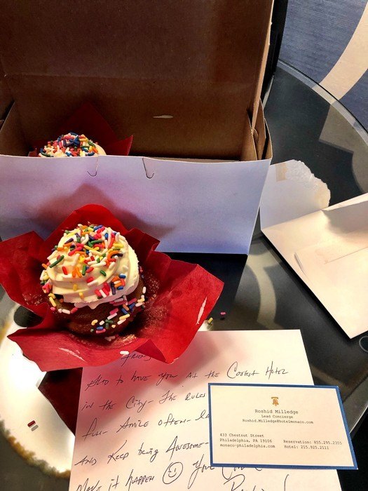 a cupcake with a welcome note