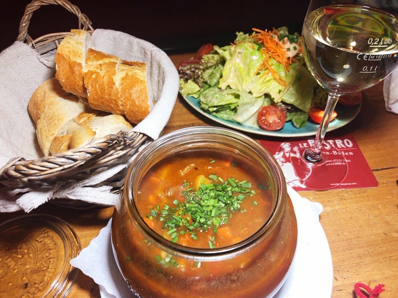 14 Best Baden Baden Tour Options You Won't Want to Miss 23 goulash soup with bread, salad and wine at le-bistro-baden-baden