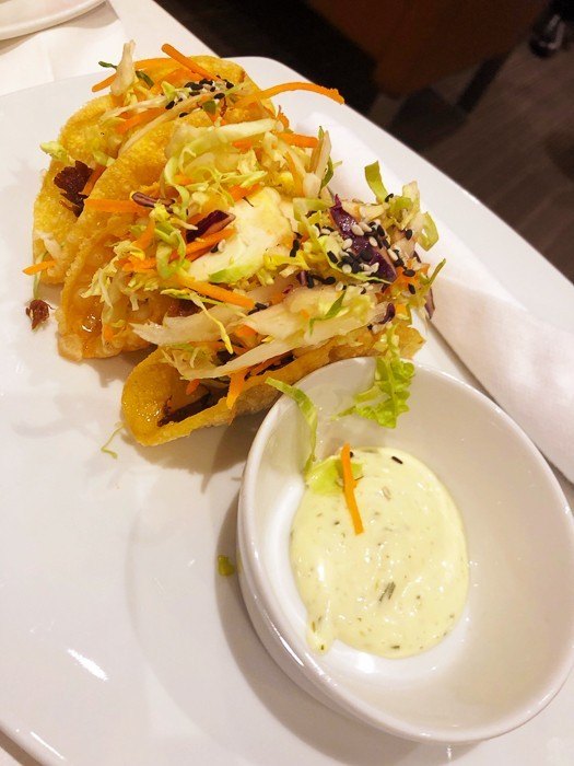 American Airlines Premium Economy 777 Review - Is it Worth Paying Extra? 7 tacos with sauce at the american airlines lounge at JFK airport New york
