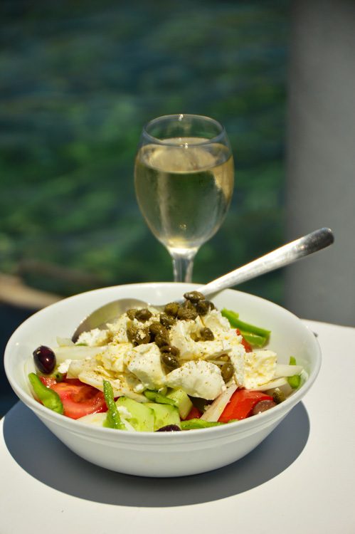 classic greek salad with glass of wine facts about greece