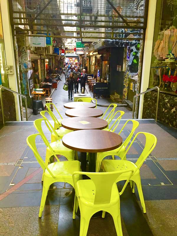 5 Best Places to Stay in Melbourne for Boutique Hotel Lovers 39 tables with yellow chairs in melbourne laneway