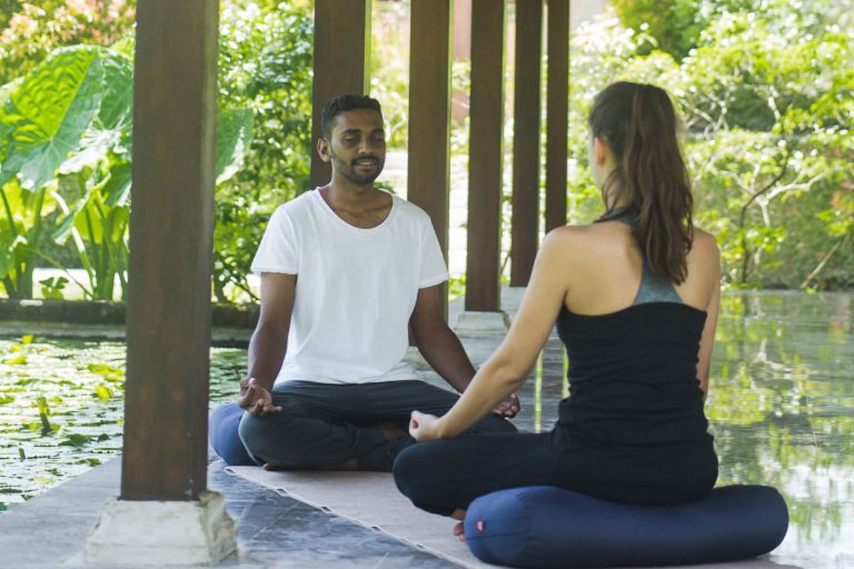 9 Incredible Bali Retreats for Singles You'll Love 8 yoga instructor and client revivo retreat bali indonesia