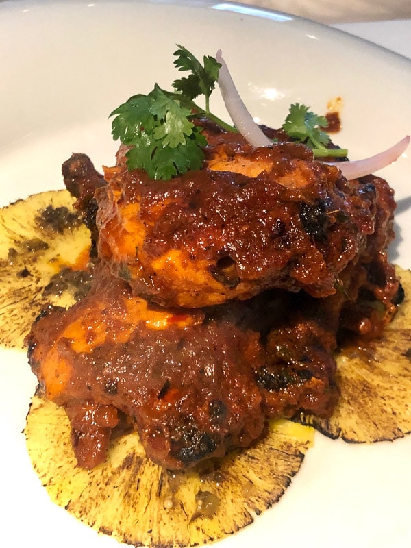 3 Day Dubai Itinerary for First Time Visitors 49 chicken in mango sauce with pineapples on white plate