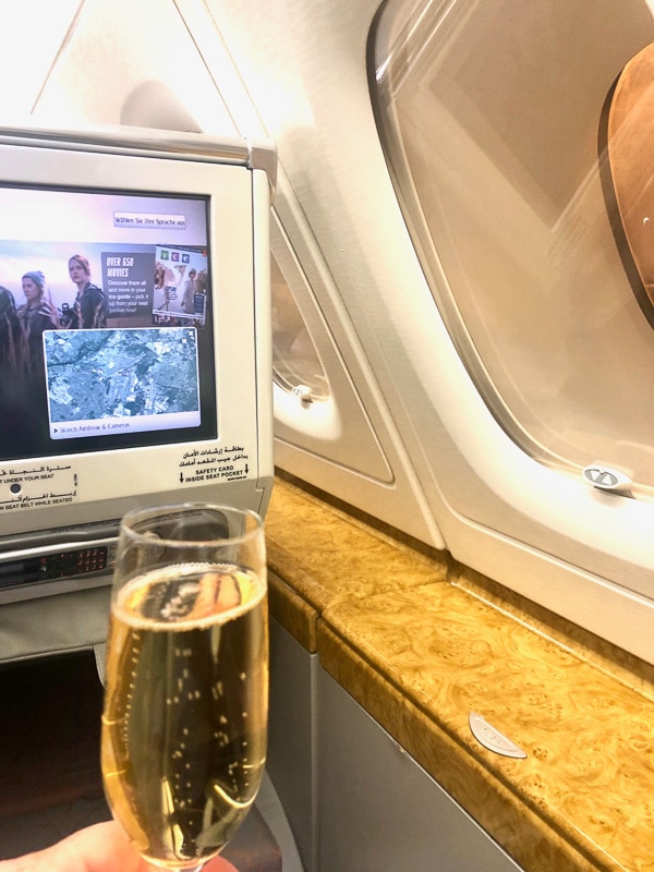Top Tip for Cheap Flights Business Class you need to know in 2022 15 glass of champagne with emirates business class ente