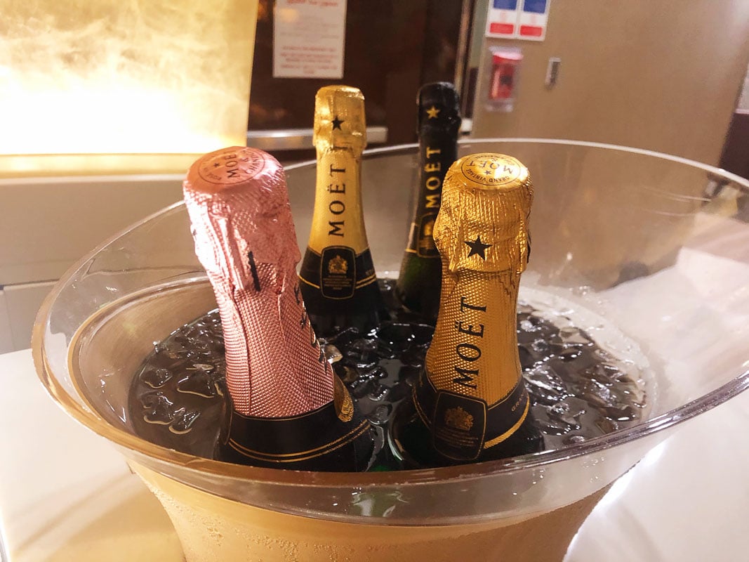 Emirates Business Class Review: Is it Worth It? 17 top of bottles of moet in a bucket of ice and water
