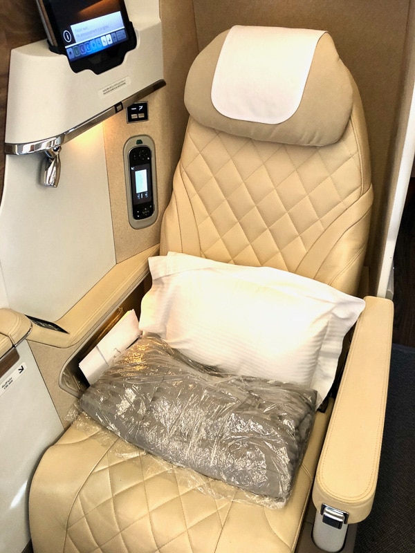 white padded seat on emirates business class
