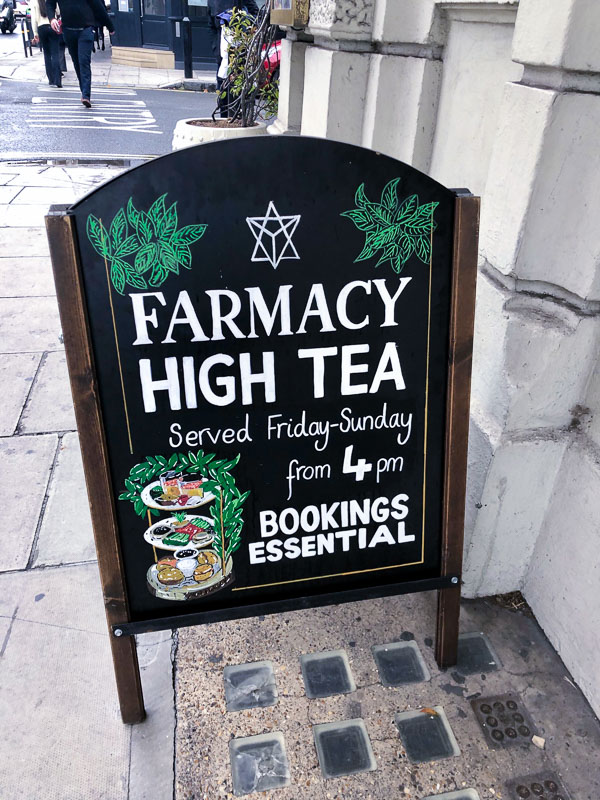 14 Fantastic Things to do in Notting Hill 9 Notting Hill London Farmacy High Tea Sign