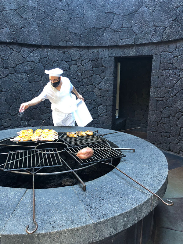 29 Best Things to do on Lanzarote That You Won't Want to Miss 57 Lanzarote timanfaya park El diablo restaurant chef with chicken
