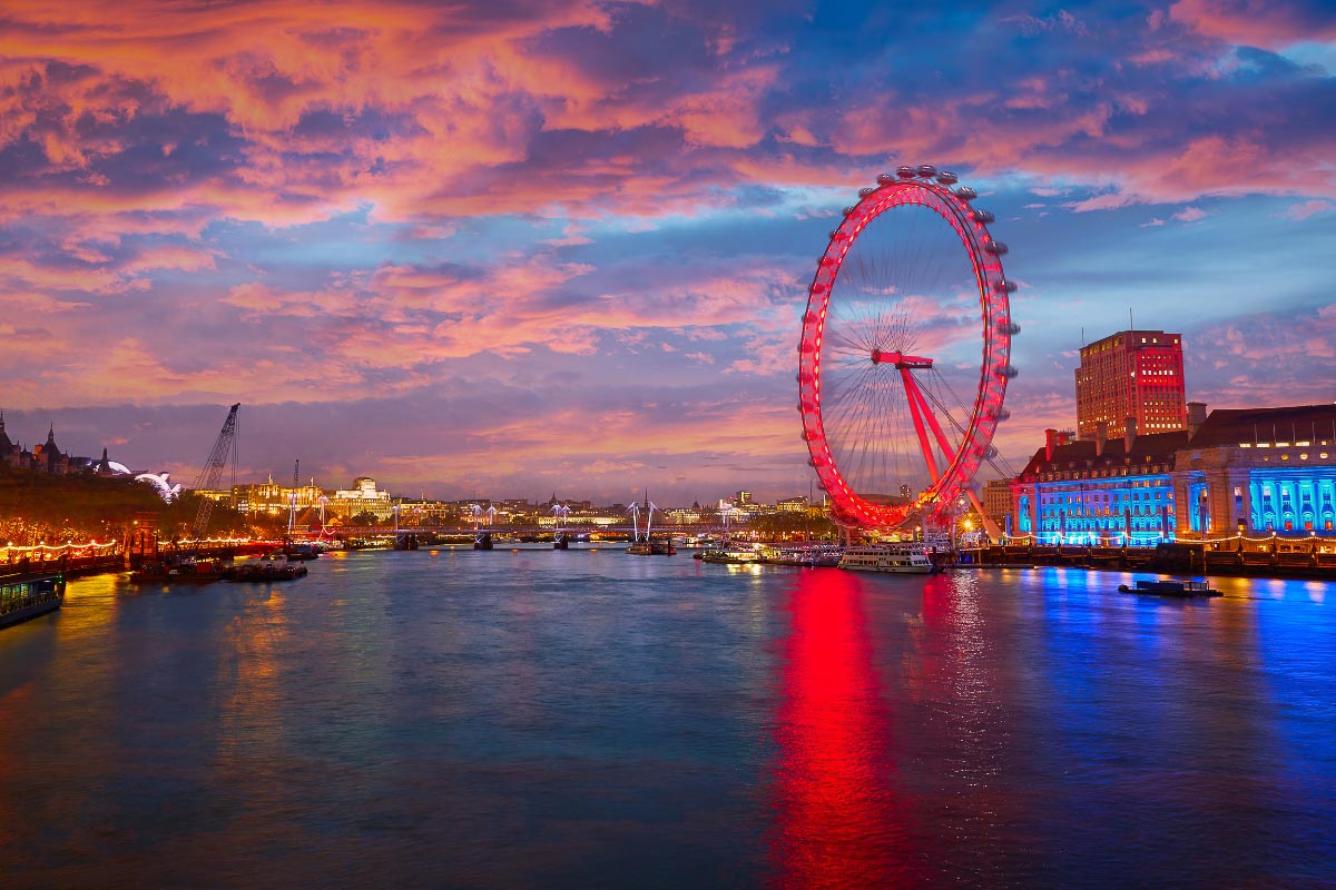 45 Impressive English Landmarks You Will Want to See 48 London Eye lit up and the thames at sunset