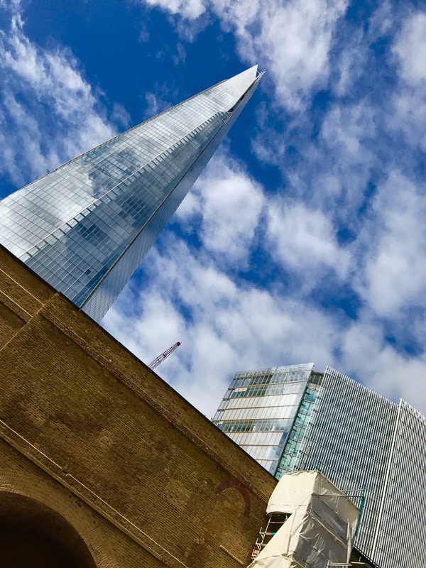 45 Impressive English Landmarks You Will Want to See 76 The Shard london against blue sky with clouds