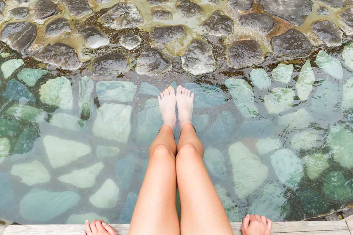 Women legs enjoys with hot springs water