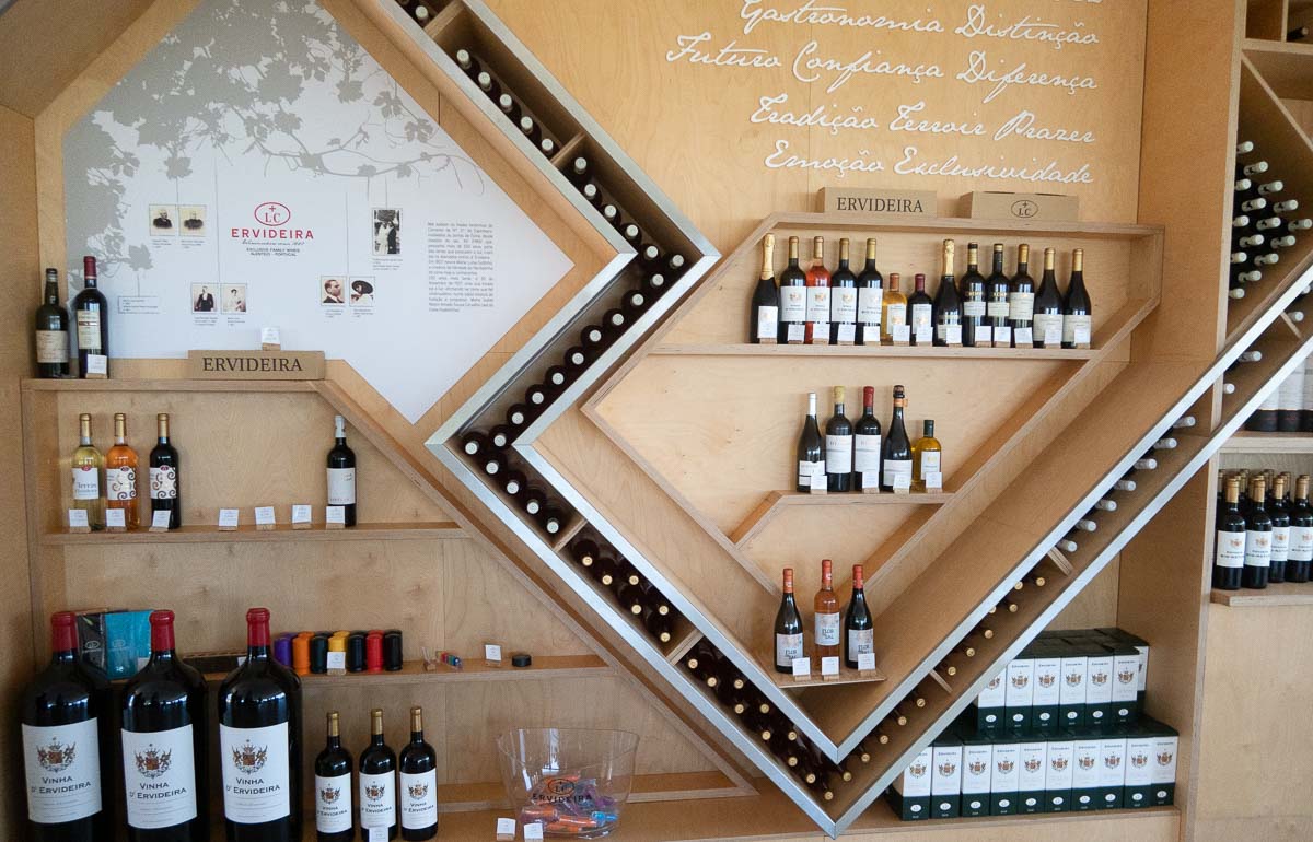 15 Fantastic Vineyards in Portugal (2022) You'll Love 25 wine merchandising at tables at inside ervideira winery alentejo