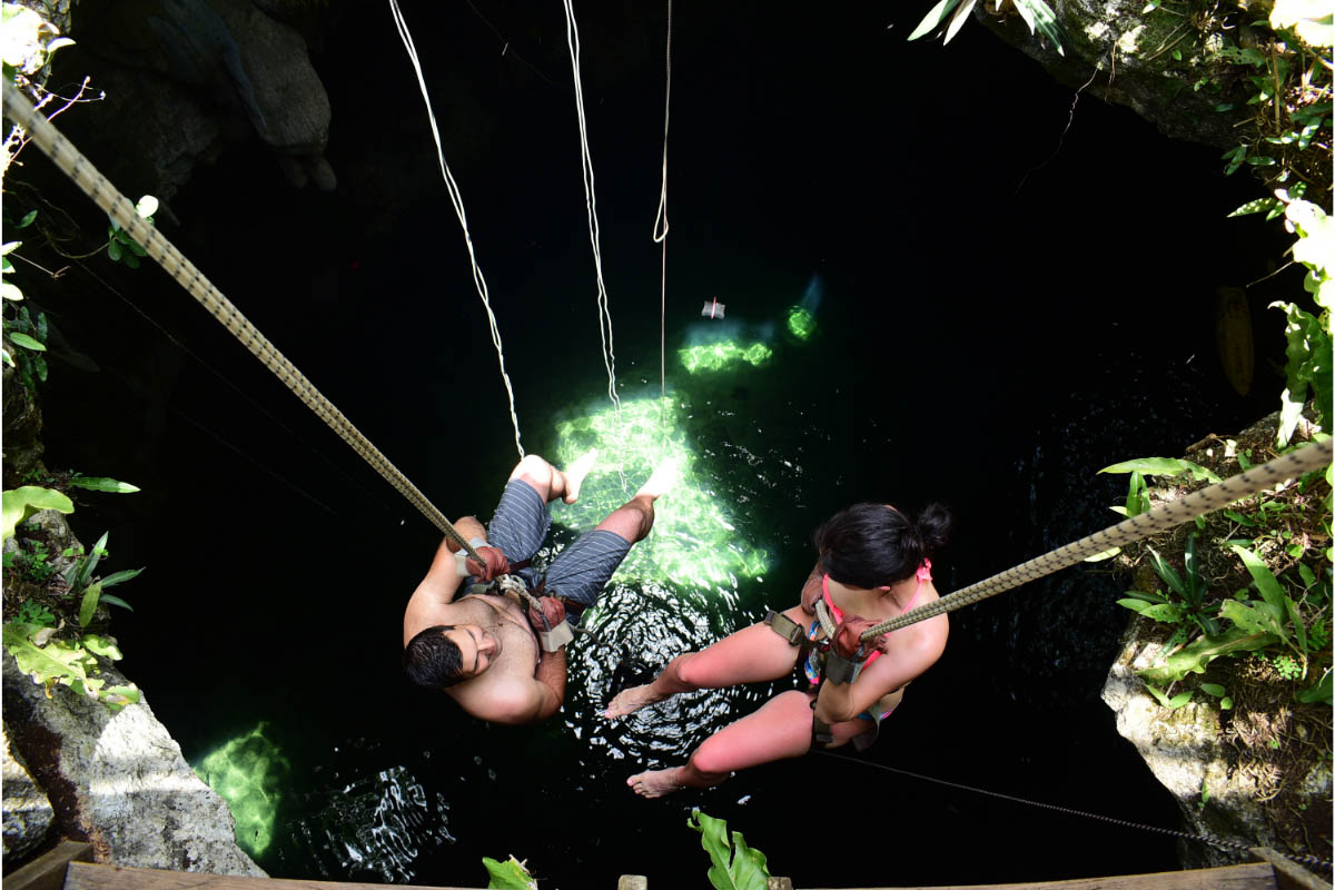 rappeling in cenote in tulum