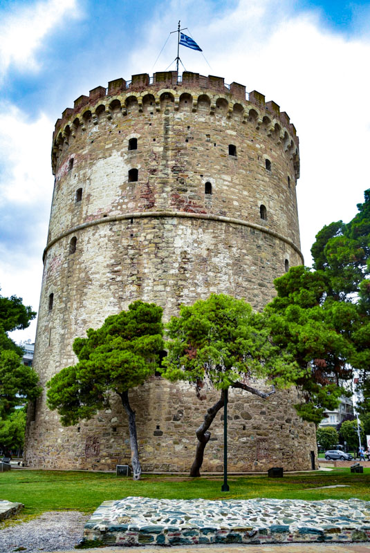 white tower of thessaloniki and trees
