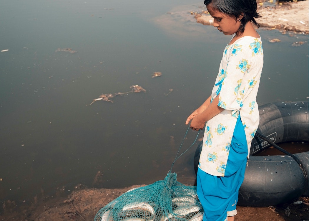 Dirty-Polluted-Water-Girl-Holding-Net