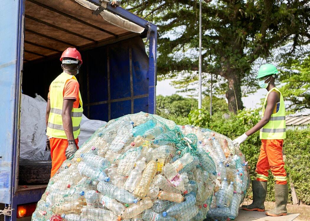 29 Most Polluted Cities in the World (2023) | Current Rankings 25 Men-working-on-Garbage-Truck